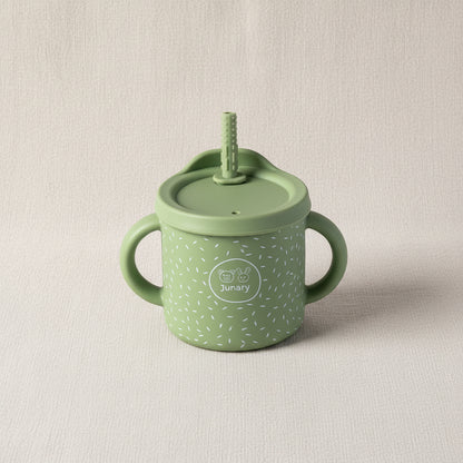 Green sips cup with two handles and removable lid wit straw. Stainless-steel and silicone speckled pattern.