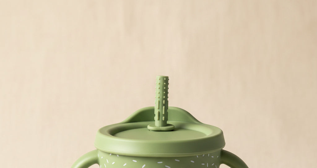 Green sips cup. Straw. Speckled silicone and stainless-steel inside.