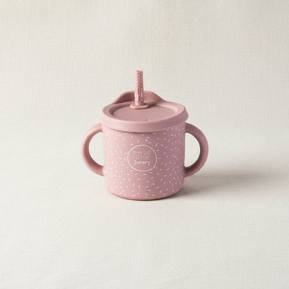 Pink sips cup with two handles and a removable lid with straw. Stainless-steel and silicone speckled pattern. 