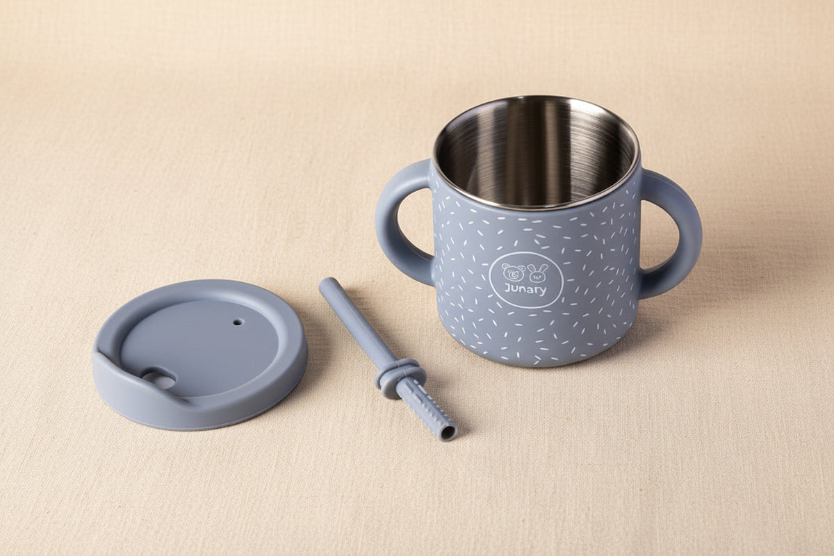 A blue speckled stainless steel and silicone Sips cup with two handles, lid and straw. 