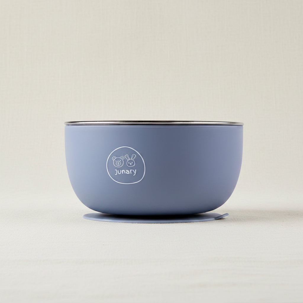 A blue silicone and Stainless-steel baby bowl with a silicone and suction base.