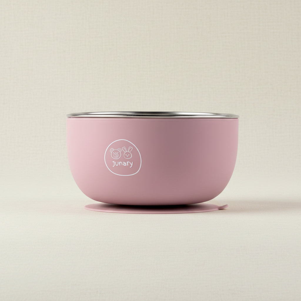 A pink Junary baby stainless-steel bowl with a silicone suction base.