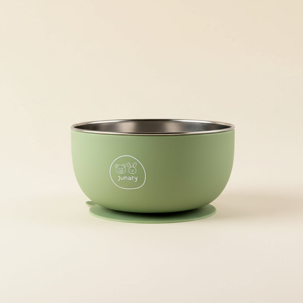 A sage green baby bowl with a matching silicone base and a white printed 'junry' logo on the front, set against a plain white background.