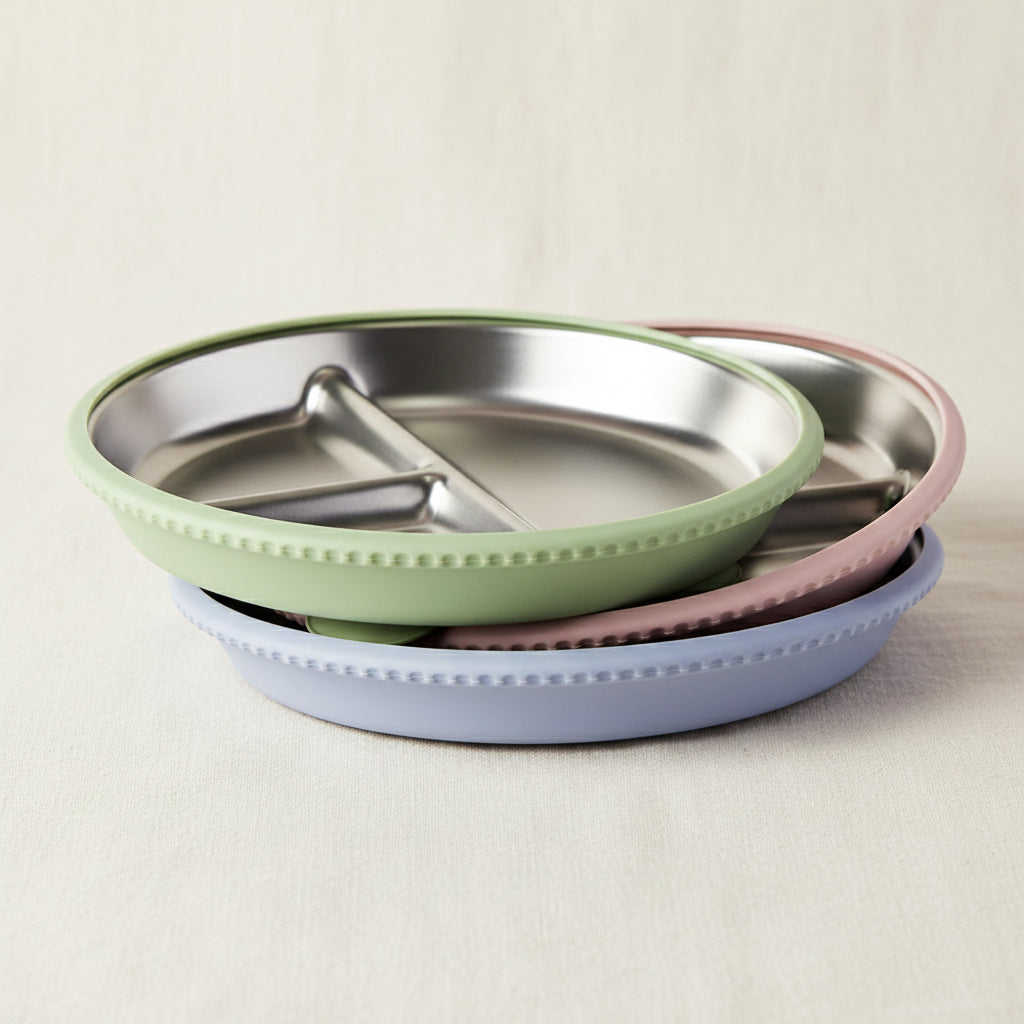 Green, Pink and Blue silicone and stainless-steel toddler plates. Divided sections in the plate, perfect for keeping different textures separate. Suction base. 
