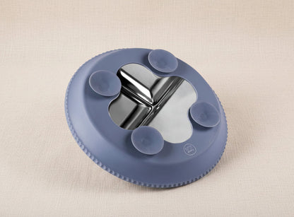 Blue silicone and stainless-steel suction plate.