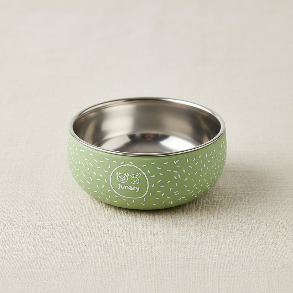Little green silicone and stainless-steel bowl with speckled pattern.