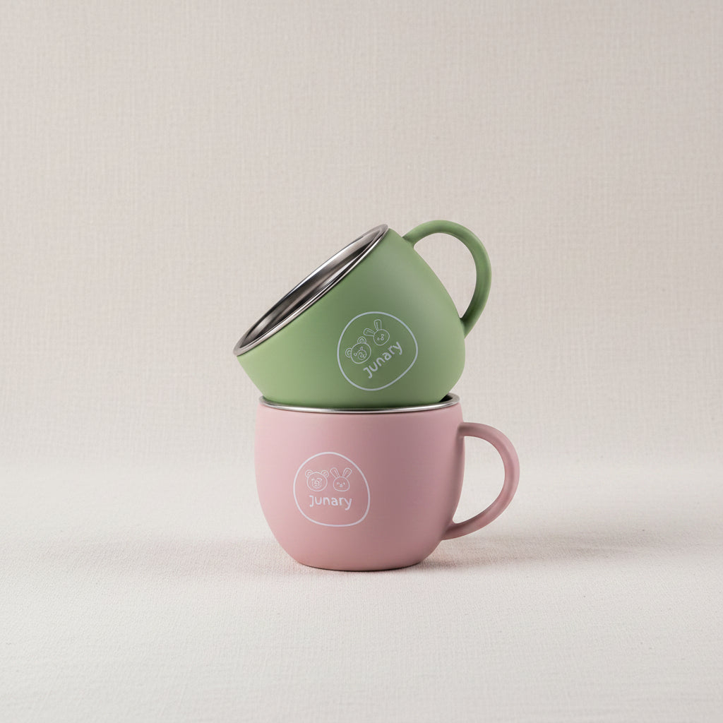 Green and Pink silicone and stainless-steel drinking cups for toddlers.