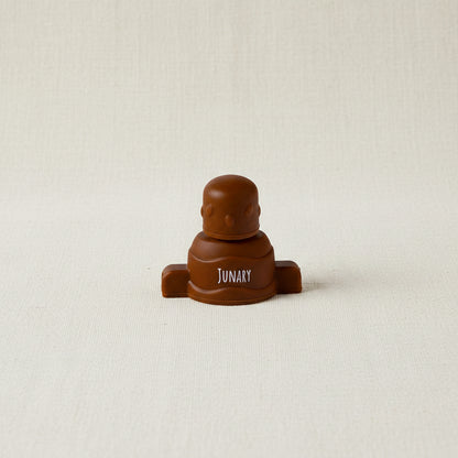 Brown silicone pouch topper for baby squishy pouches. 