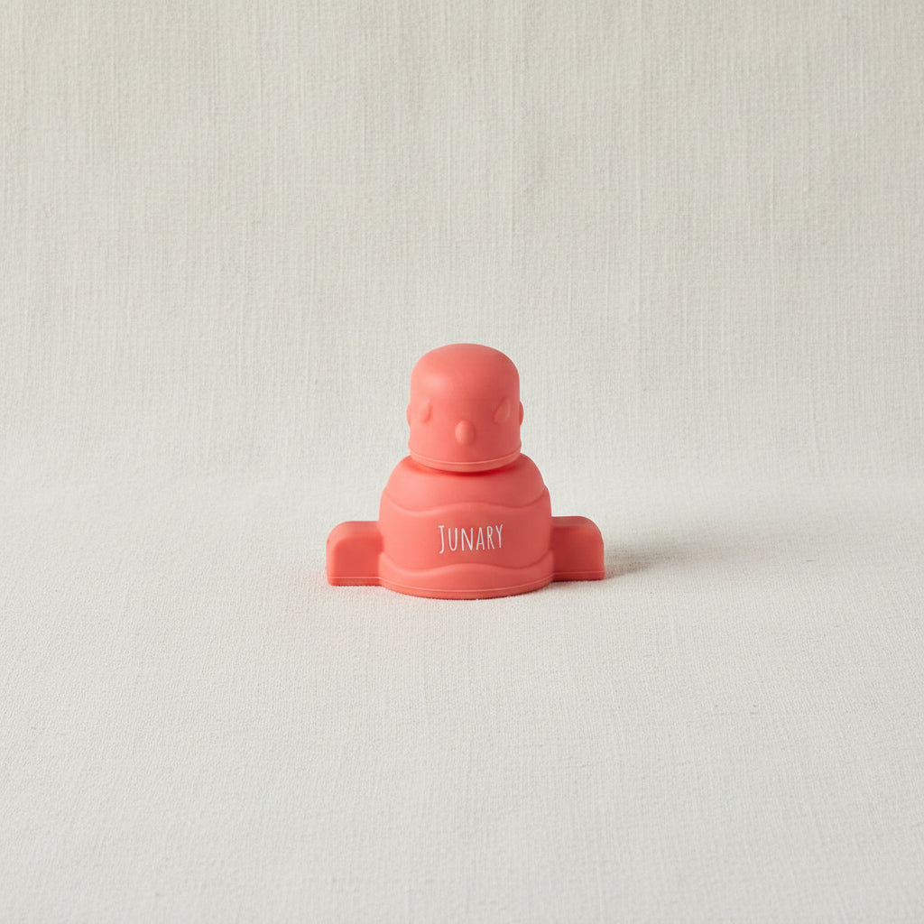 Pink silicone pouch topper for baby squishy pouches. 