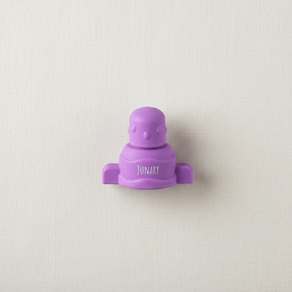 Purple silicone pouch topper for baby squishy pouches. 