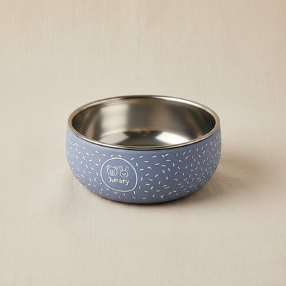 Little blue silicone and stainless-steel bowl with speckled pattern.