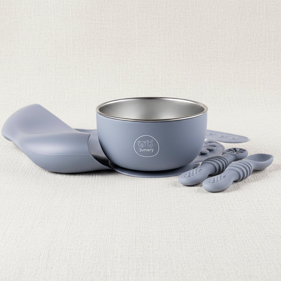 Blue 3-piece Silicone baby feeding set. Including a stainless-steel bowl with suction, a Silicone bib and slow feeders 