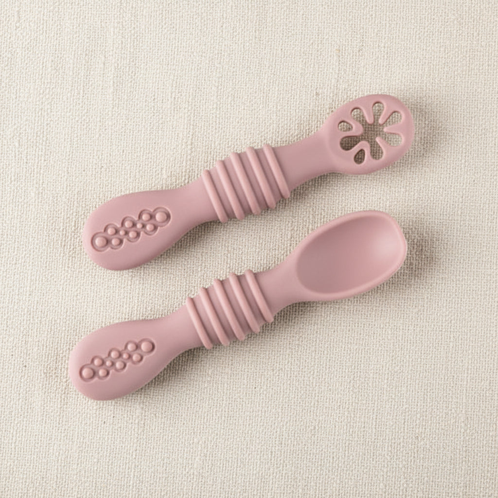 Silicone slow feeders for babies. Pink in color.