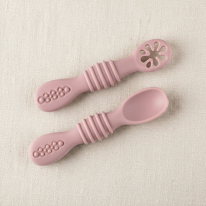Silicone slow feeders for babies. Pink in color.
