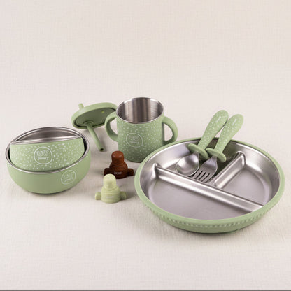 A green and stainless-steel baby feeding set, including a divided plate with utensils, a cup, a Little bites bowl and a mighty bites bowl. Cutlery and a green and brown pouch toppers.