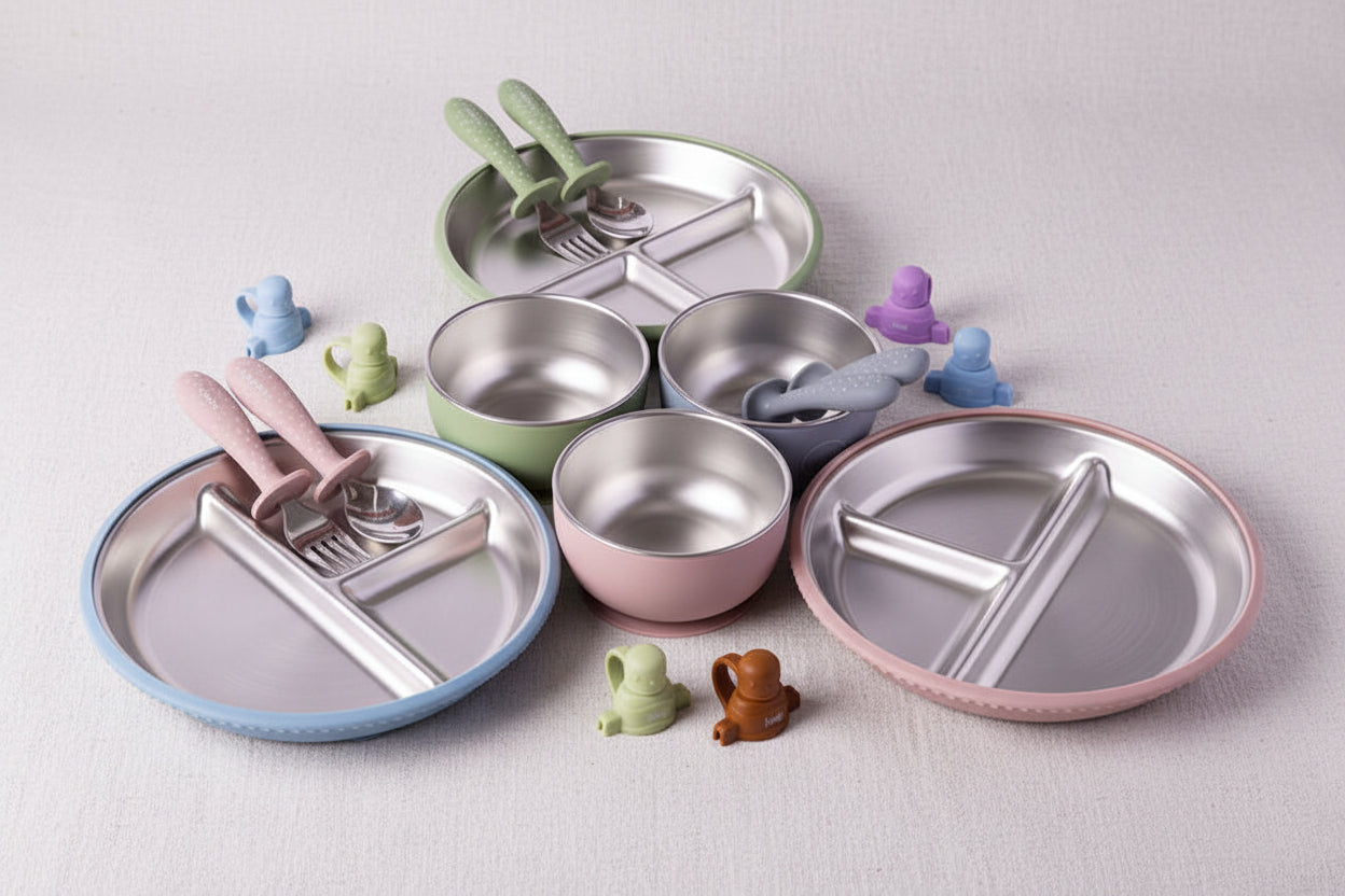 Sets of baby feeding accessories including stainless steel divided plates, bowls, spoon and fork. Pouch Toppers.